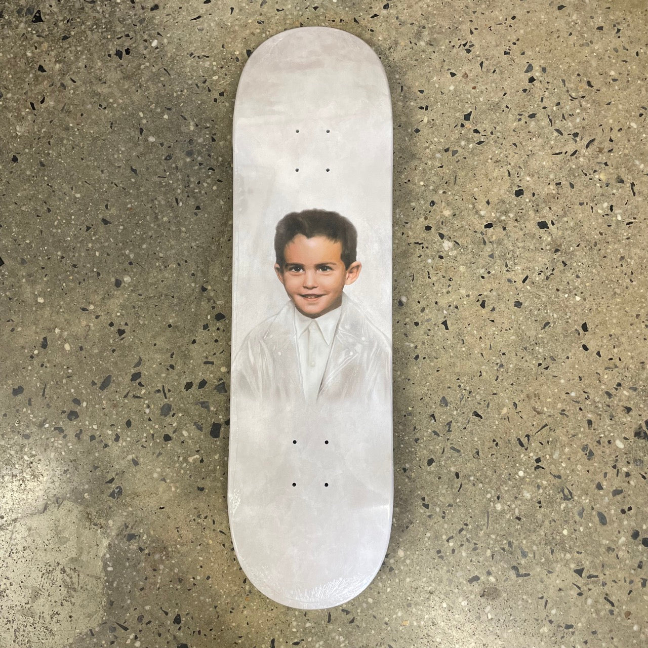 white skateboard deck with a painted portrait of dylan rieder